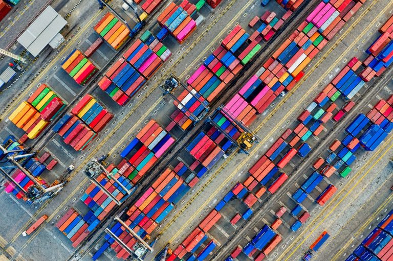Many types & colours of cargo containers, represent the many types of logistics available | OneLogix Cargo Solutions